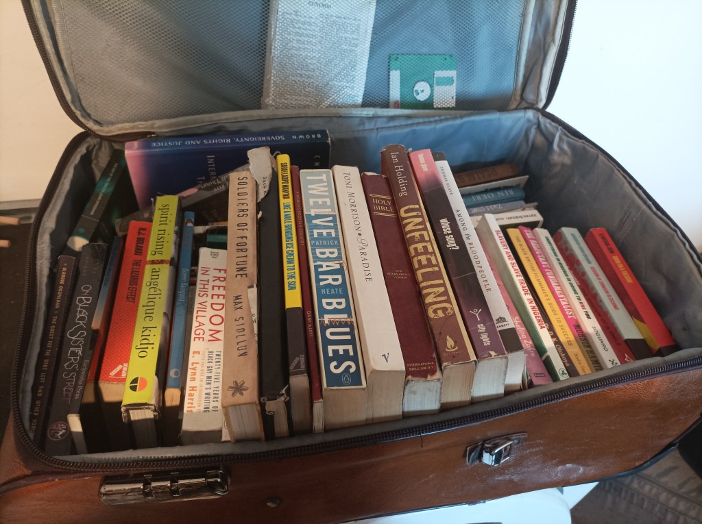 Books in a leather suitcase